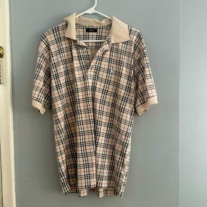 Burberry polo all over print.